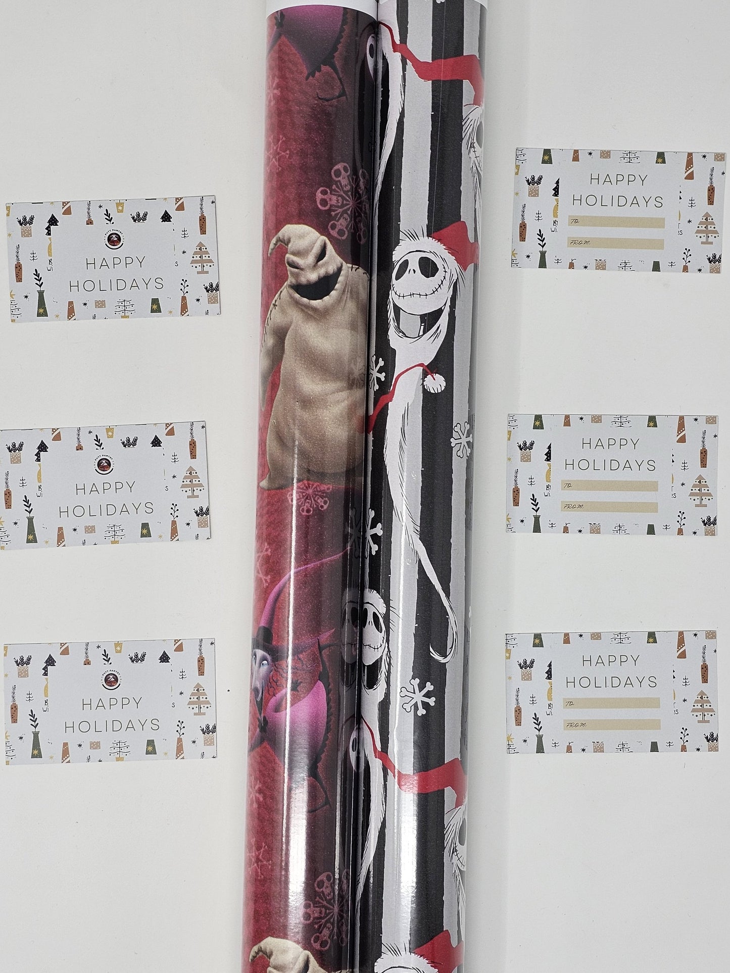 2 Rolls of Nightmare Before Christmas Wrapping Paper, 1 Roll 60 Sq Ft of Nightmare Before Christmas Jack Skellington Snowy Wrapping paper and 1 Roll 60 Sq Ft of Oogie Boogie, Barrel, Sally and Jack Skellington Wrapping Paper, With 6 Holiday Gift Tags.