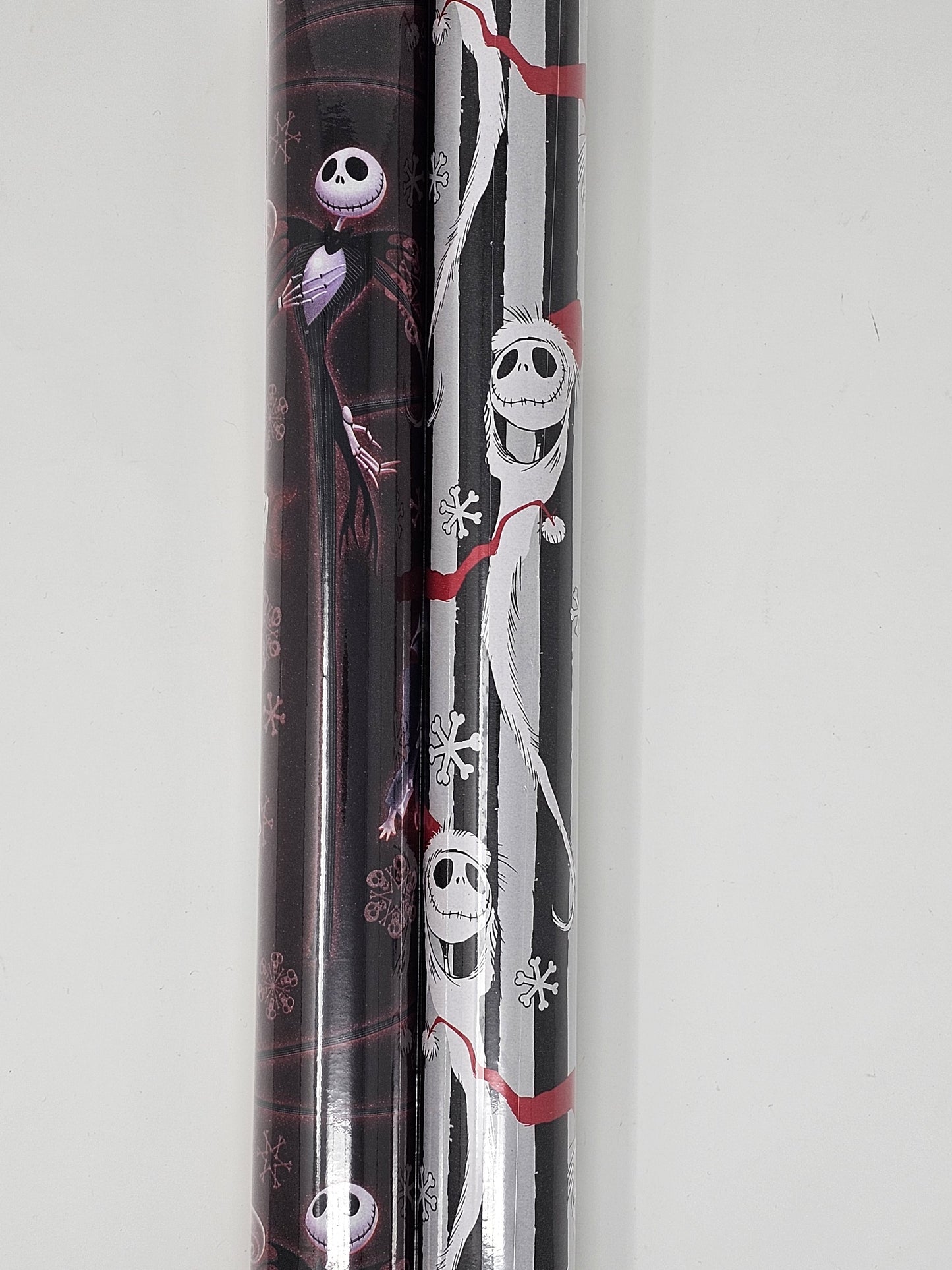 2 Rolls of Nightmare Before Christmas Wrapping Paper, 1 Roll 60 Sq Ft of Nightmare Before Christmas Jack Skellington Snowy Wrapping paper and 1 Roll 60 Sq Ft of Oogie Boogie, Barrel, Sally and Jack Skellington Wrapping Paper, With 6 Holiday Gift Tags.