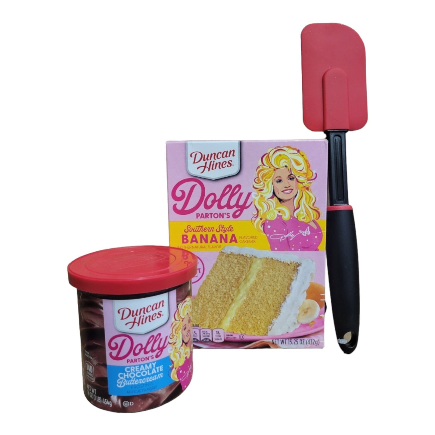 Dolly Parton Cake Gift Bundle for Valentine's Day, 1 15.25 oz box of cake mix, 1 16 oz container of frosting, 1 spatula, and a heart shaped basket