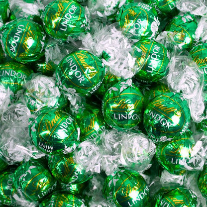 Putt Pantry St. Patricks Day Gnome Decor Bundle, 2 Decorative St Patty Kitchen Towels, Set of Gnome Salt and Pepper Shakers, 1 lb of Milk Chocolate Mint Truffles, packaged by Putt Pantry in a Wire Basket.