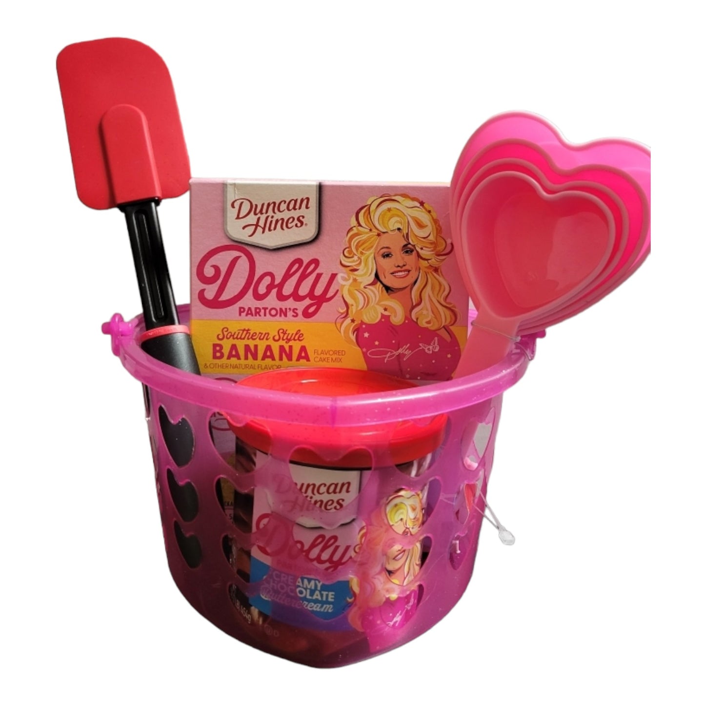Dolly Parton Cake Gift Bundle for Valentine's Day, 1 15.25 oz box of cake mix, 1 16 oz container of frosting, 1 spatula, and a heart shaped basket