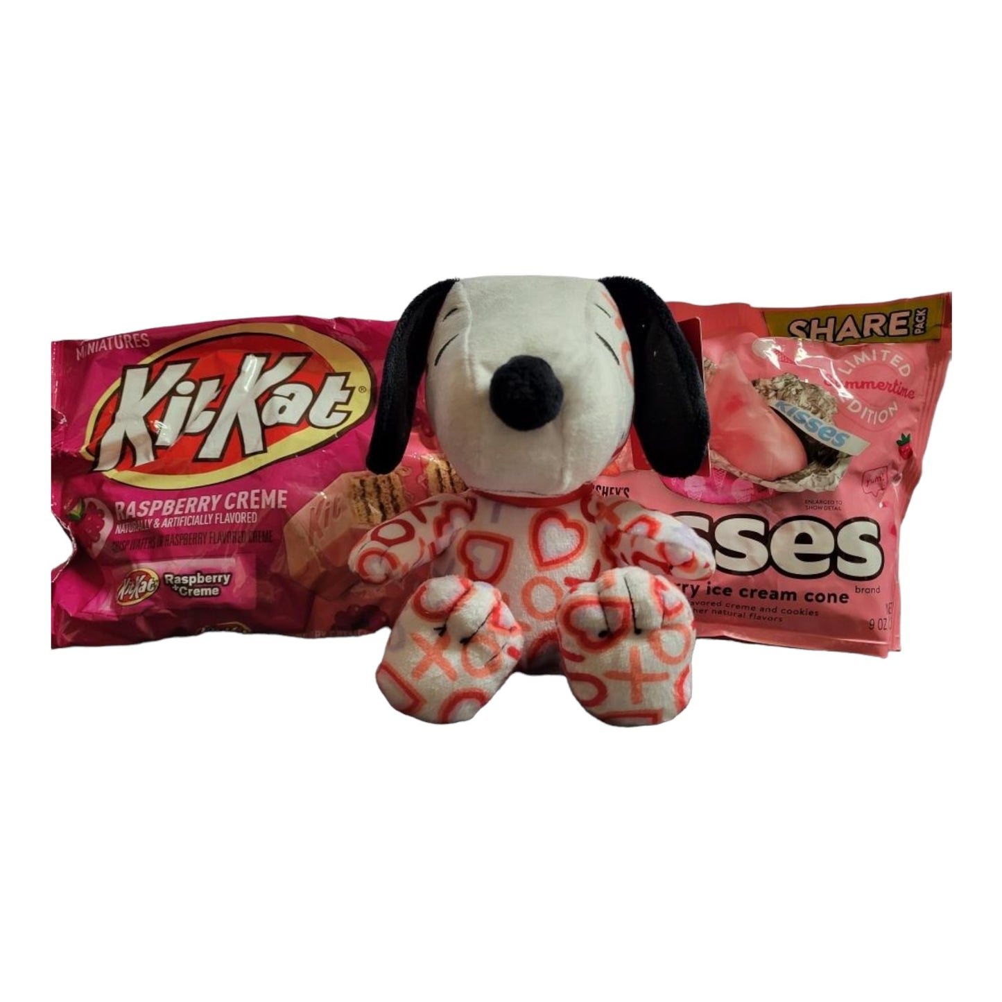 Valentines's Day Snoopy Bundle Basket. 1 plush Heart Snoopy, 1 9 oz bag Hershey's Chocolate Dipped Strawberry Kisses, 1 8.8 oz bag of Hershey's Pink Cookies N' Creme Hearts, with Heart Shaped Basket