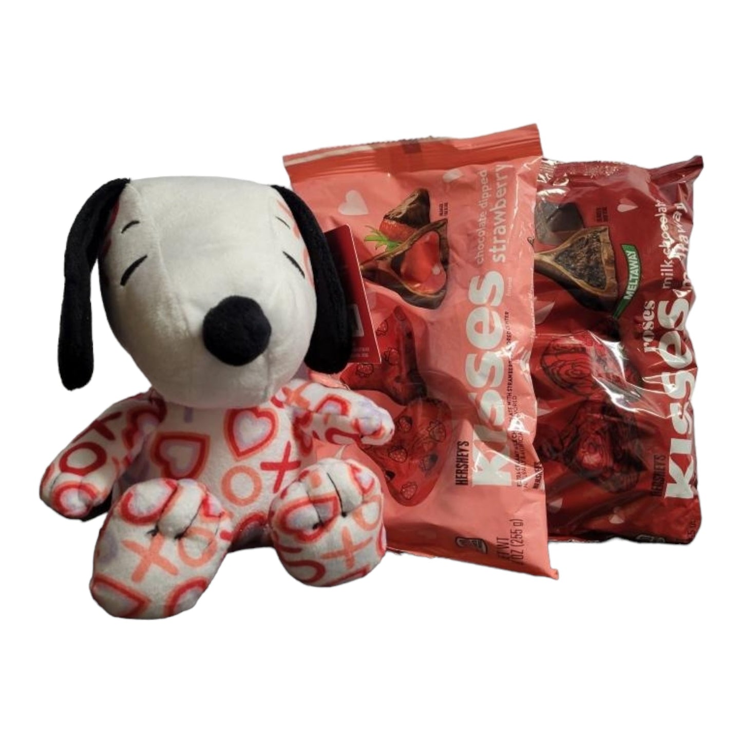 Valentines's Day Snoopy Bundle Basket. 1 plush Heart Snoopy, 1 9 oz bag Hershey's Chocolate Dipped Strawberry Kisses, 1 8.8 oz bag of Hershey's Pink Cookies N' Creme Hearts, with Heart Shaped Basket
