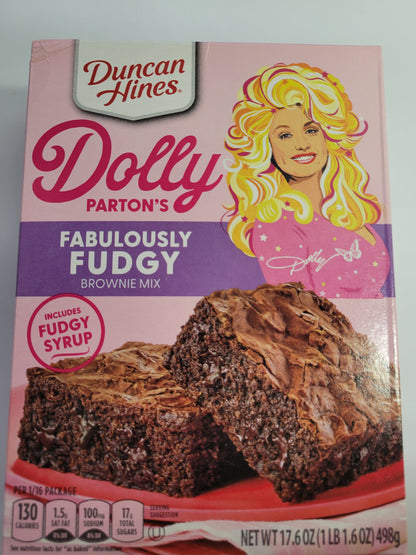Duncan Hines Dolly Parton Brownie Bundle, 1 box 17.6 oz of Dolly Partons Fabulously Fudgy Brownie Mix, 1 box 16.7 oz of Dolly Parton Carmel Turtle Brownie Mix, 2 containers 16 oz of Dolly Partons Creamy Buttercream Frosting and 1 spatula