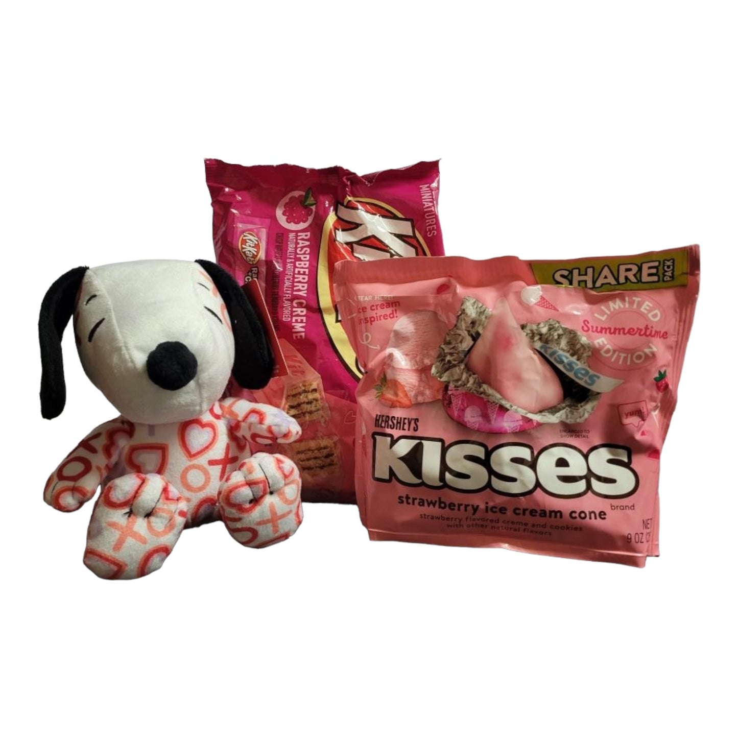 Valentines's Day Snoopy Bundle Basket. 1 plush Heart Snoopy, 1 9 oz bag Hershey's Chocolate Dipped Strawberry Kisses, 1 8.8 oz bag of Hershey's Pink Cookies N' Creme Hearts, with Heart Shaped Basket