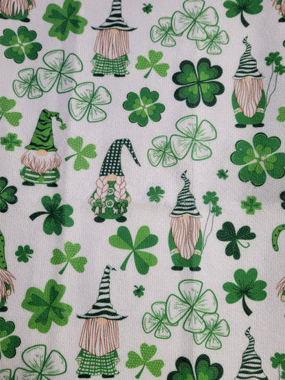 Putt Pantry St. Patricks Day Gnome Decor Bundle, 2 Decorative St Patty Kitchen Towels, Set of Gnome Salt and Pepper Shakers, 1 lb of Milk Chocolate Mint Truffles, packaged by Putt Pantry in a Wire Basket.